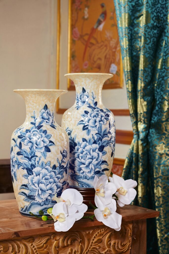 pexels-photo-27824607-27824607-1 Charming blue floral porcelain vases with white orchids in a luxurious traditional setting.